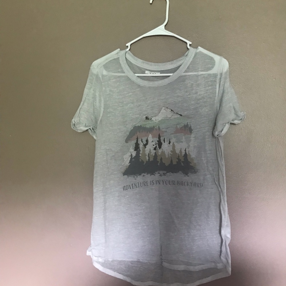 Sheer white “Adventure is in your back yard” medium size T shirt